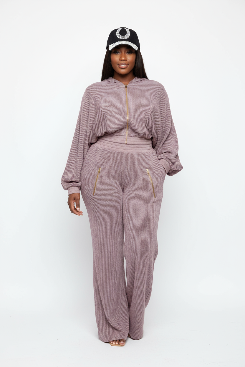 Black woman in hoodie set with crystal cap