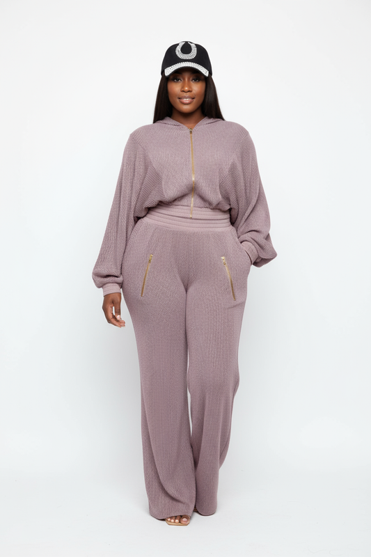 Black woman in hoodie set with crystal cap